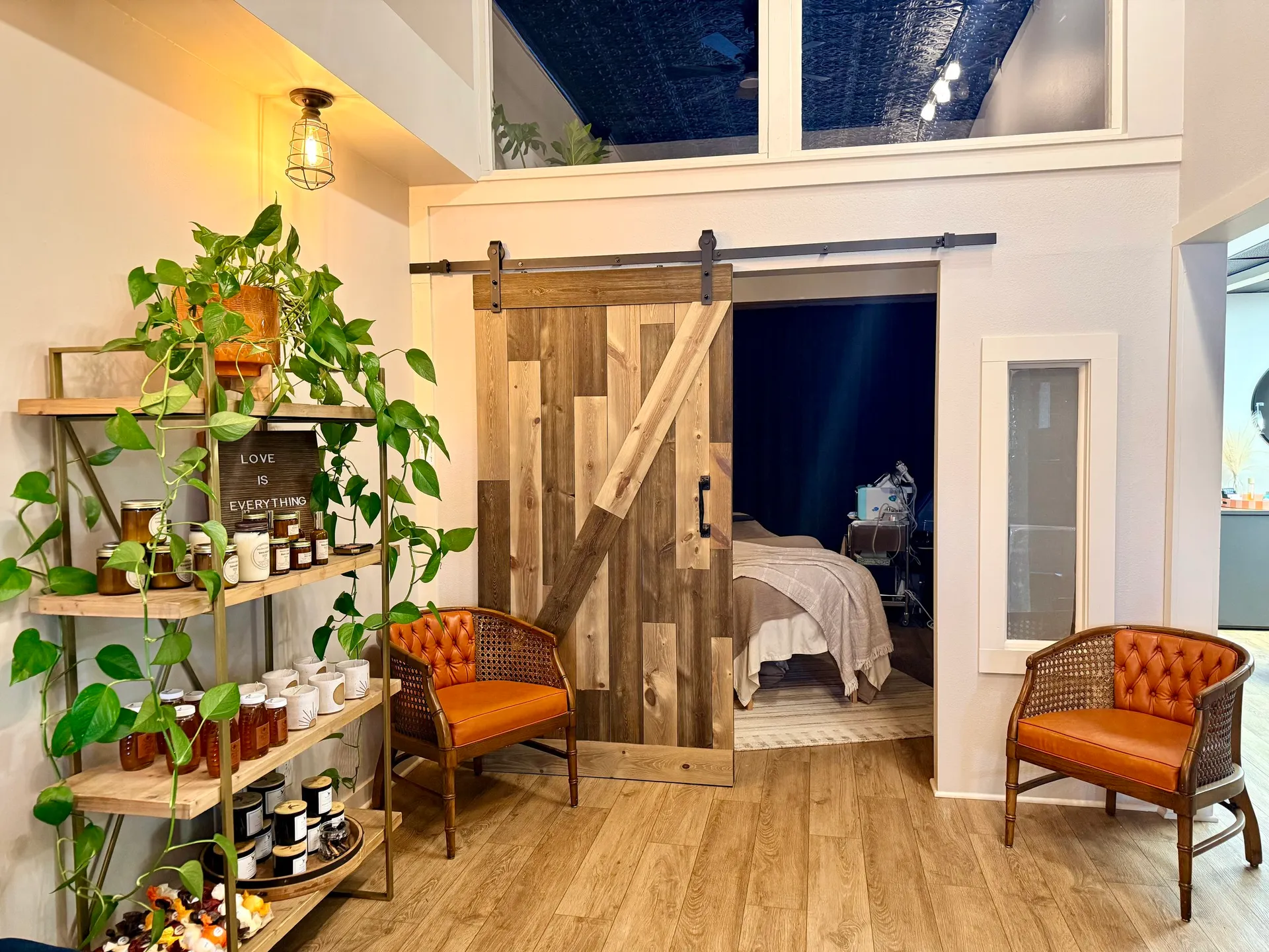 Cozy studio seating and product shelves at Pure Skin Esthetic